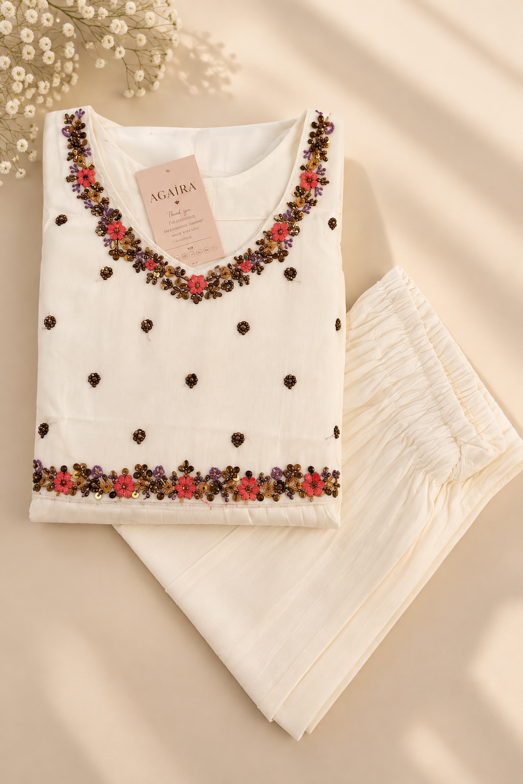 White mul kurta with hand-beaded jewelled trim. Handcrafted traditional Indian co-ord set.