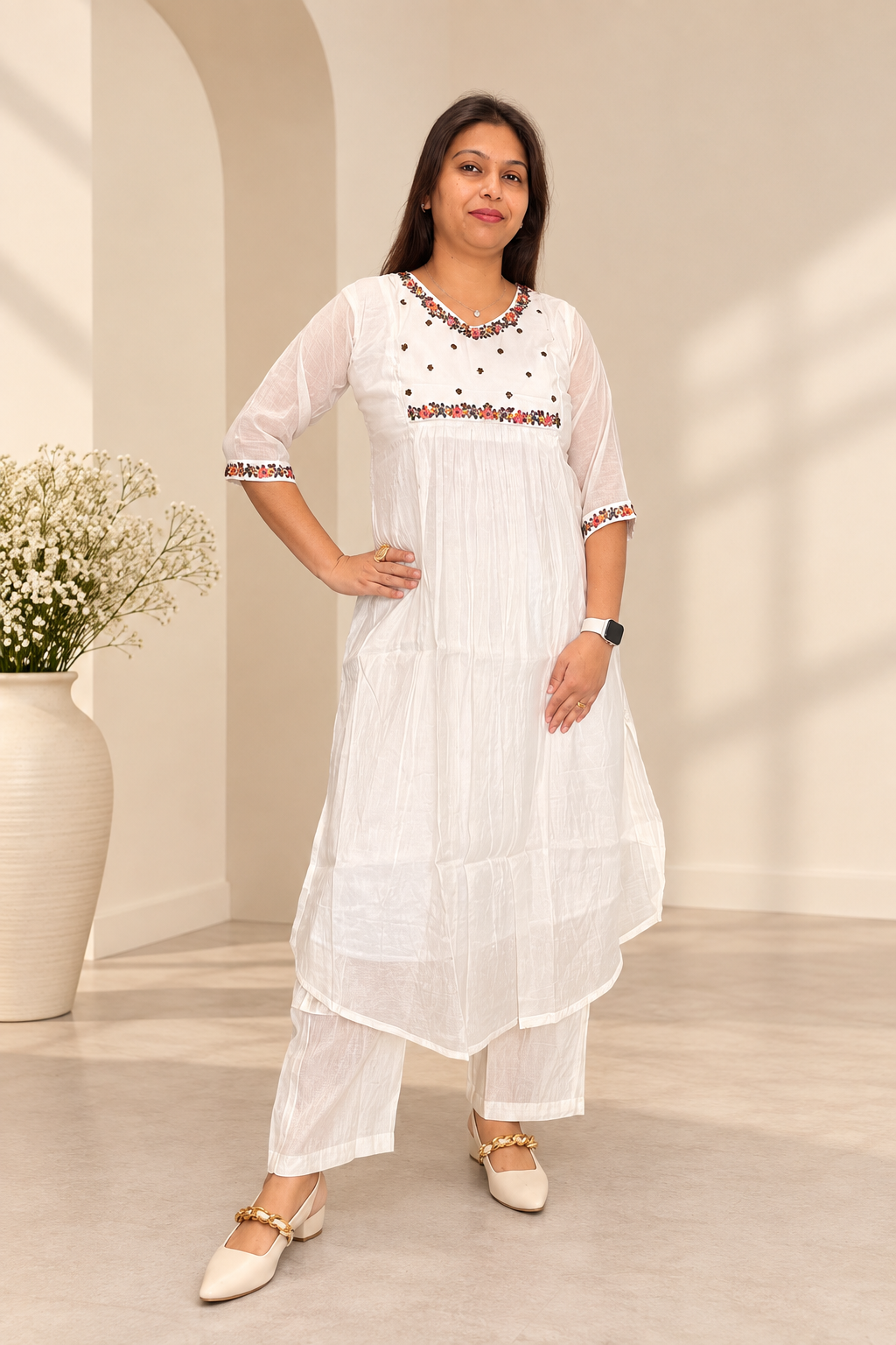 White mul kurta with hand-beaded jewelled trim. Handcrafted traditional Indian co-ord set.