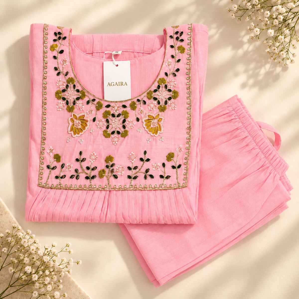 Pink mul co-ord with hand-beaded neckline. Gathered traditional Indian kurta set.