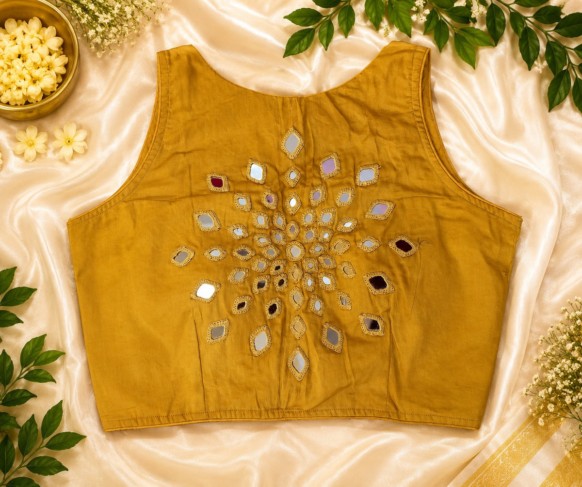 Mustard yellow Abhla Bharat mirror work padded sleeveless blouse. Festival party wear saree blouse.