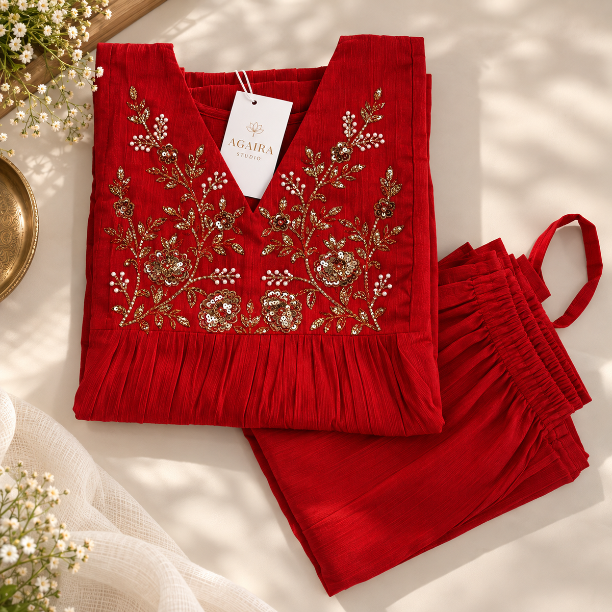 Red Vatican silk co-ord with hand-embroidered gold detailing. Festive gathered kurta set.