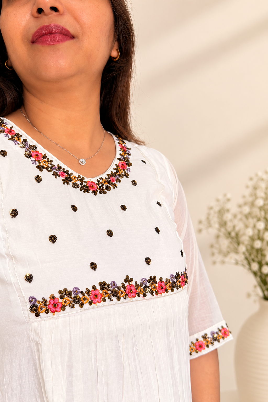 White mul kurta with hand-beaded jewelled trim. Handcrafted traditional Indian co-ord set.
