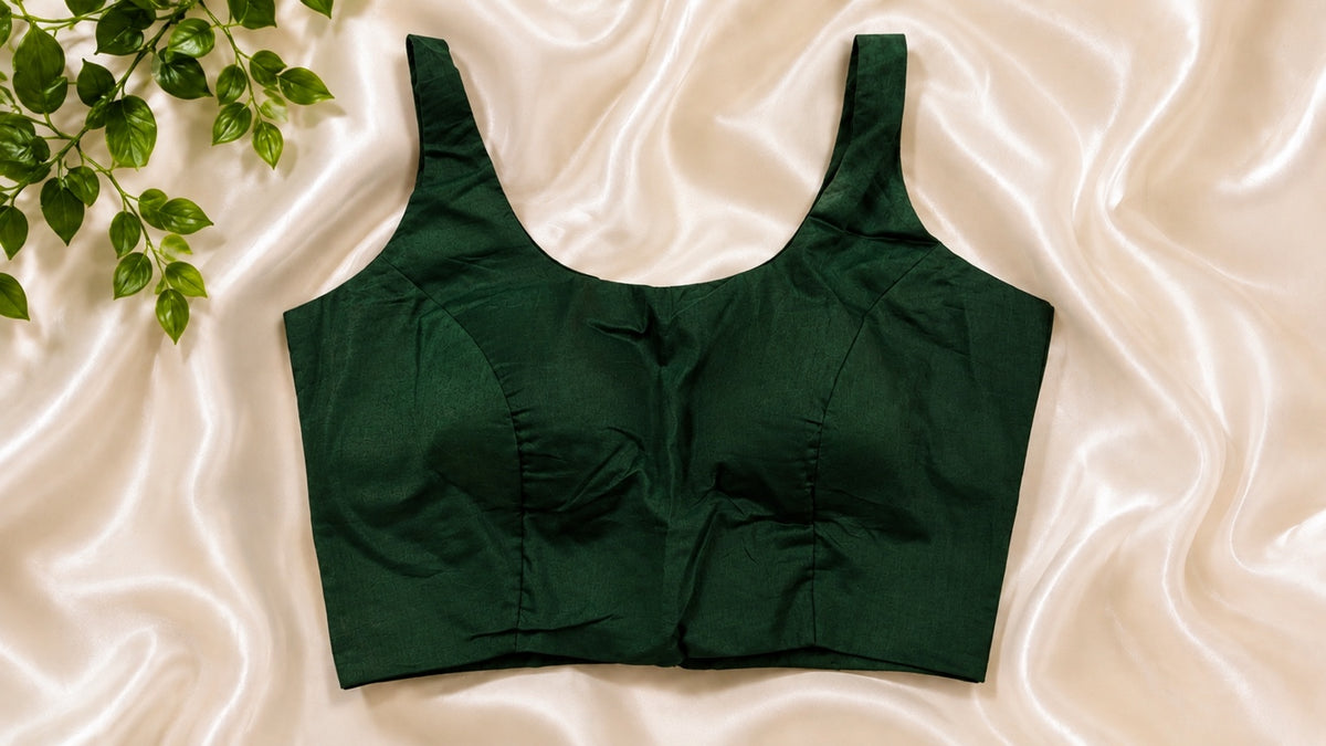 Emerald green padded cotton Lycra sleeveless blouse. Comfortable stretchable saree blouse.