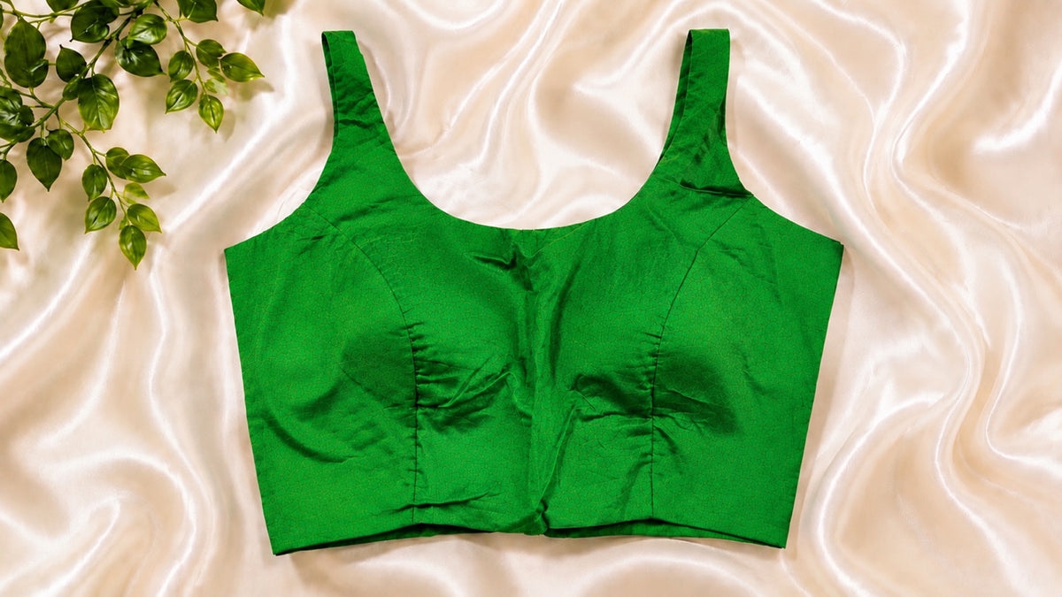 Emerald green padded cotton Lycra sleeveless blouse. Comfortable stretchable saree blouse.