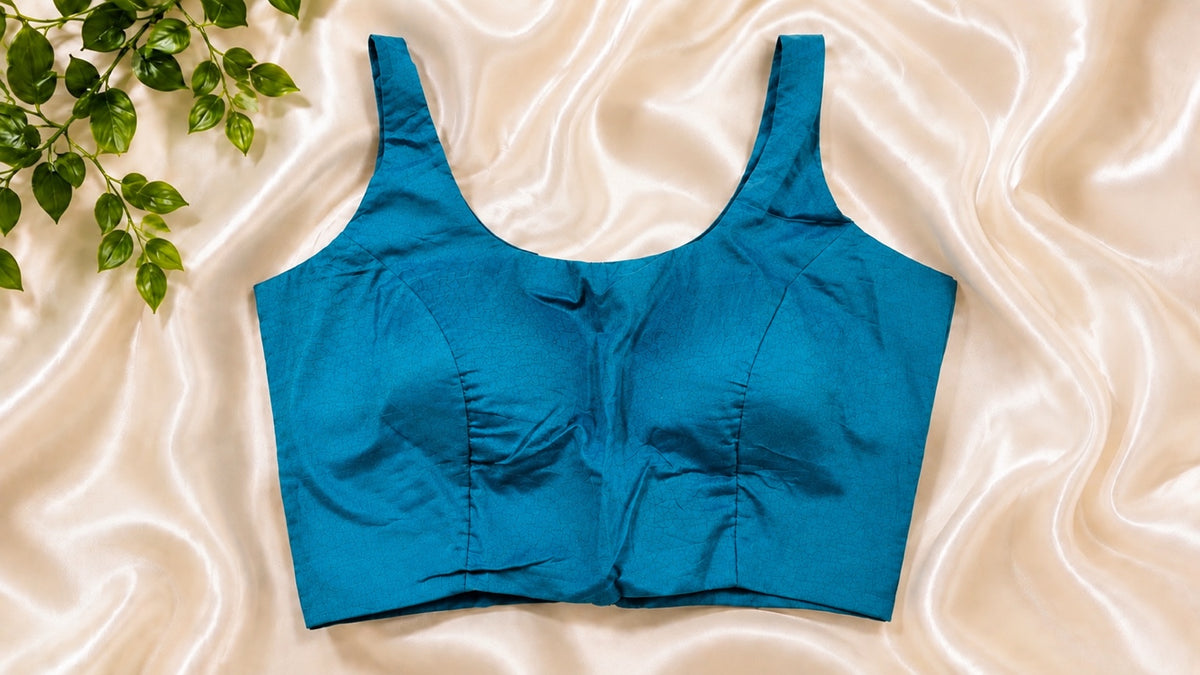 Emerald green padded cotton Lycra sleeveless blouse. Comfortable stretchable saree blouse.